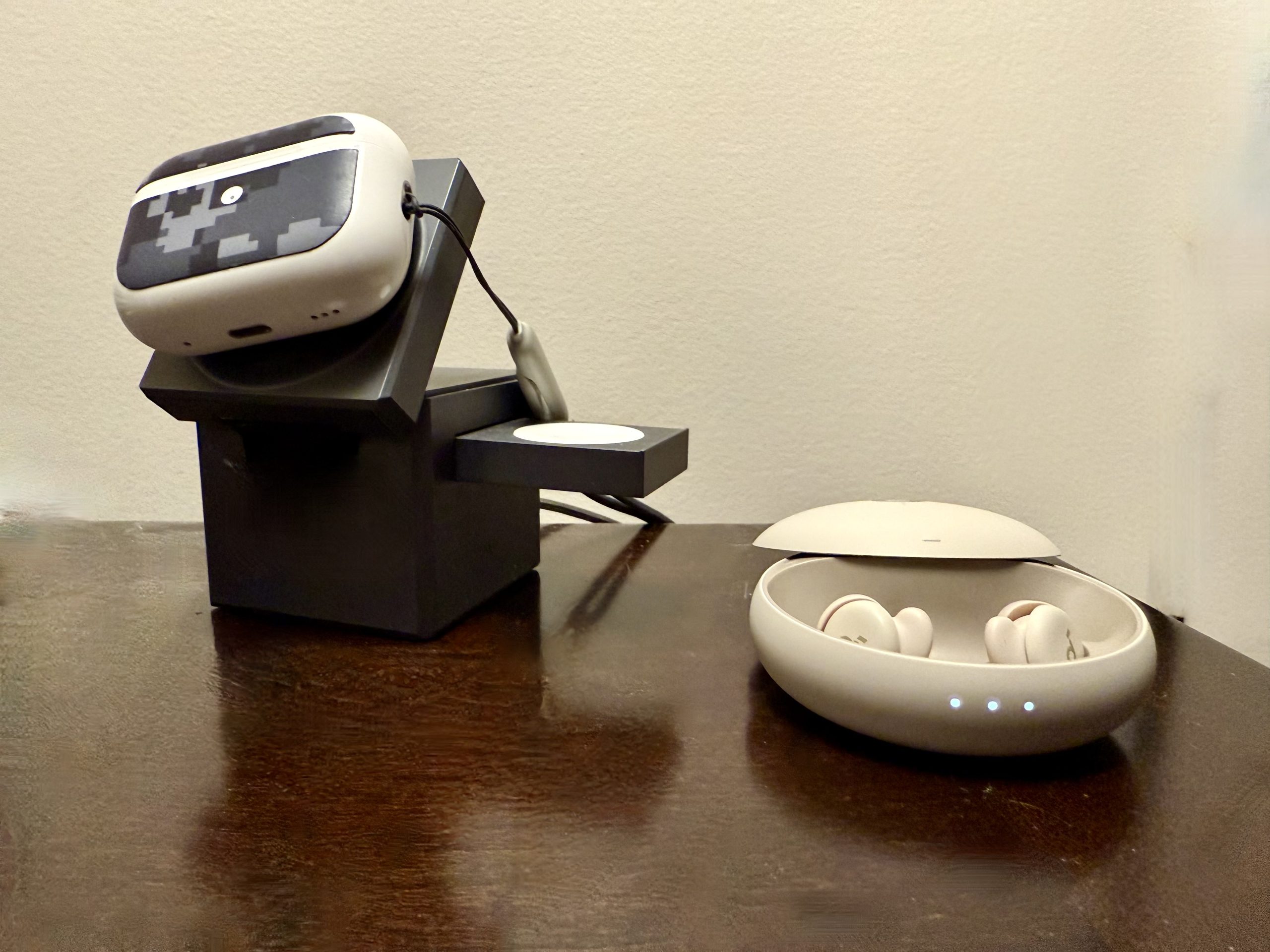 My Soundcore Sleep A20 Earbuds by Anker next to my AirPods Pro 2